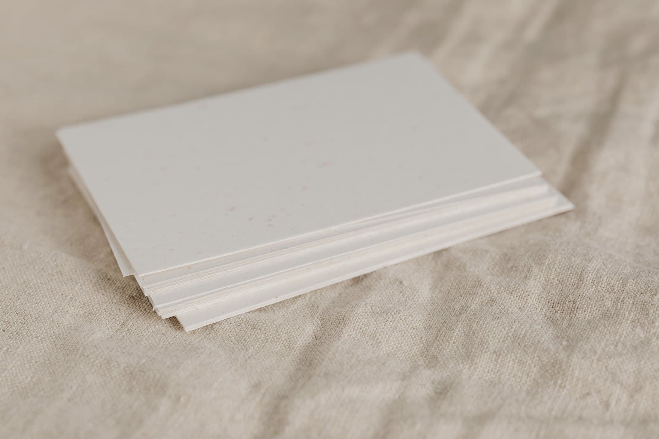 Stack of board and paper sheets, edges in view